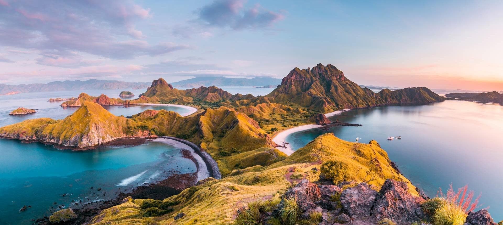 Turquoise water threading between the limestone karsts of Padar Island
